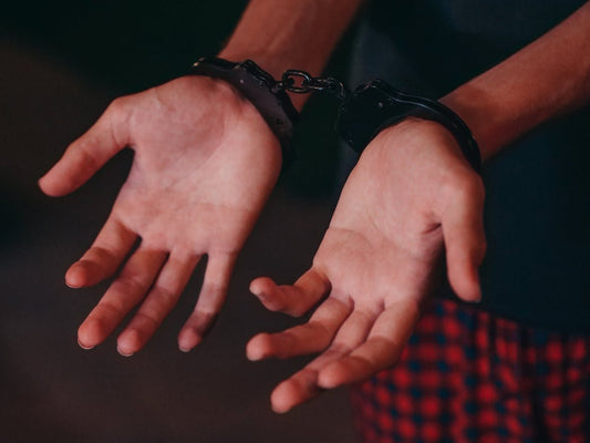 Reference picture of cuffed hands on why is weed illegal